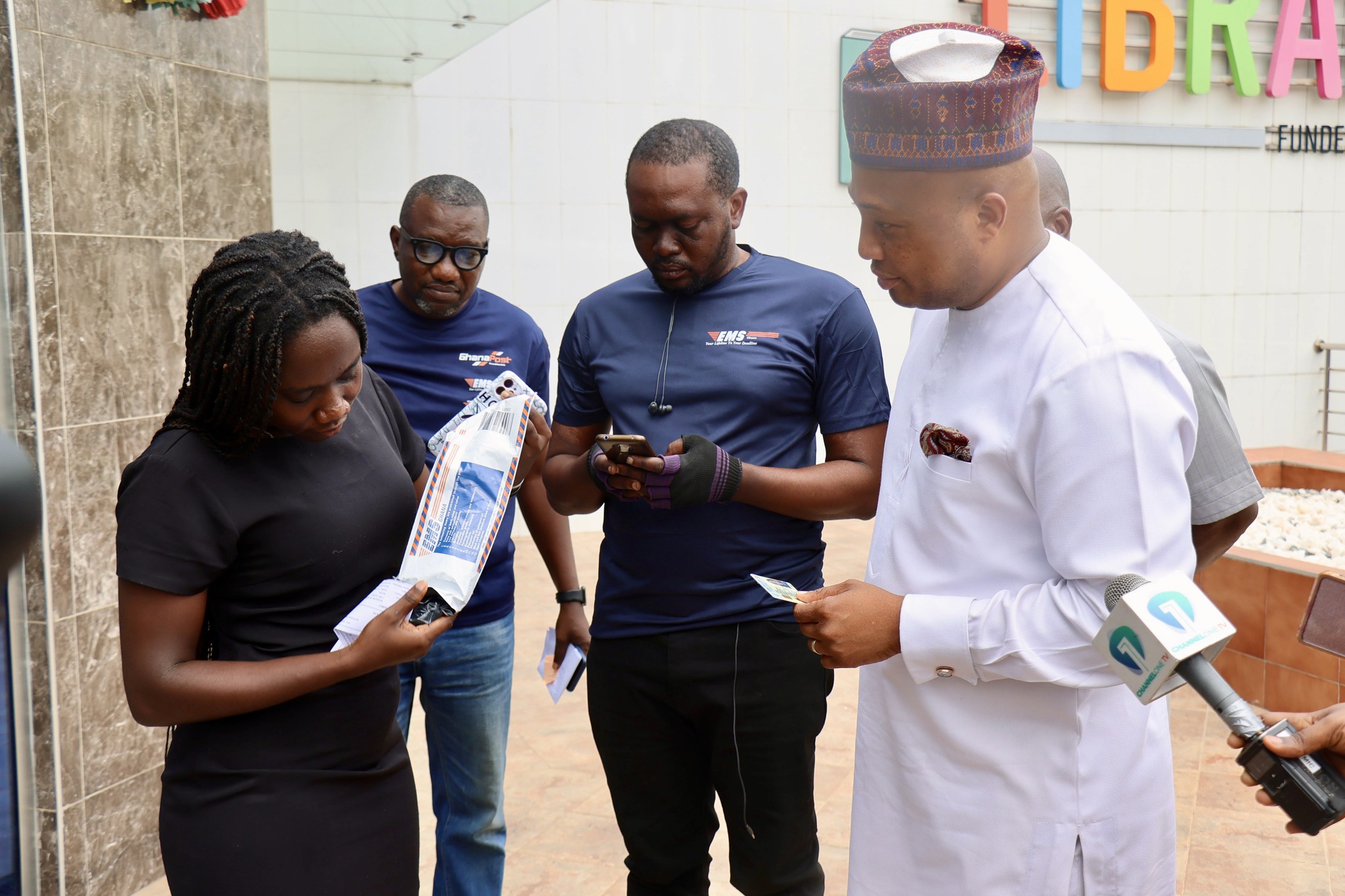 Foreign Affairs Minister personally delivers passports to applicants in Accra