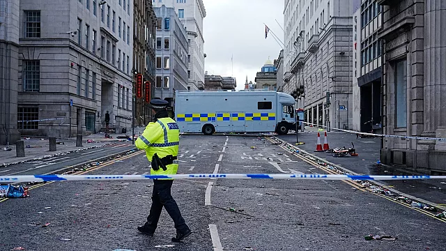 Dozens injured after car strikes crowd during Liverpool FC title celebration