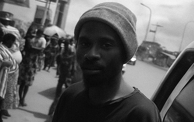 Loading boy at a bus stop