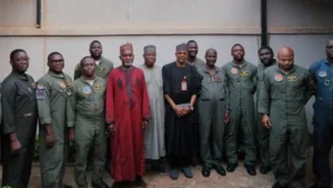 Nigeria’s Foreign Minister Yusuf Tuggar with the now released servicemen